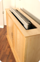 Cabinet containing a concealed TV lift